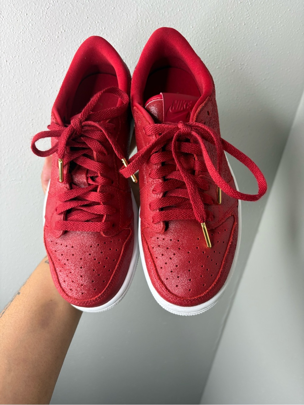 Nike Women’s Red Low-Top Sneakers with Gold Accents